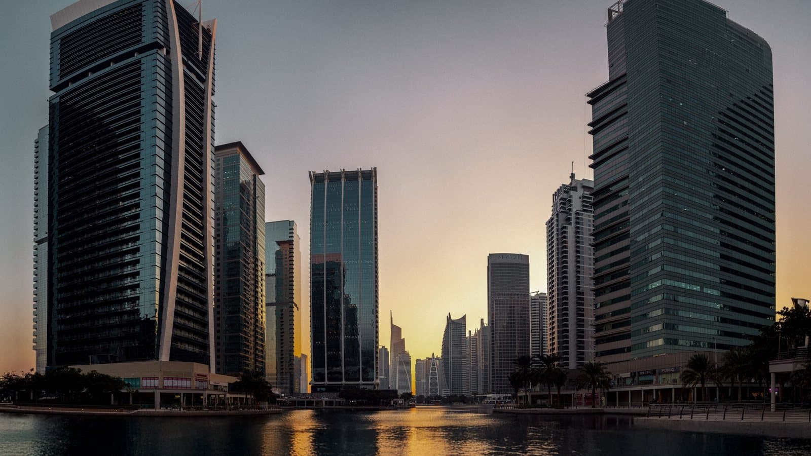 Waterfront apartment towers in Dubai at golden hour