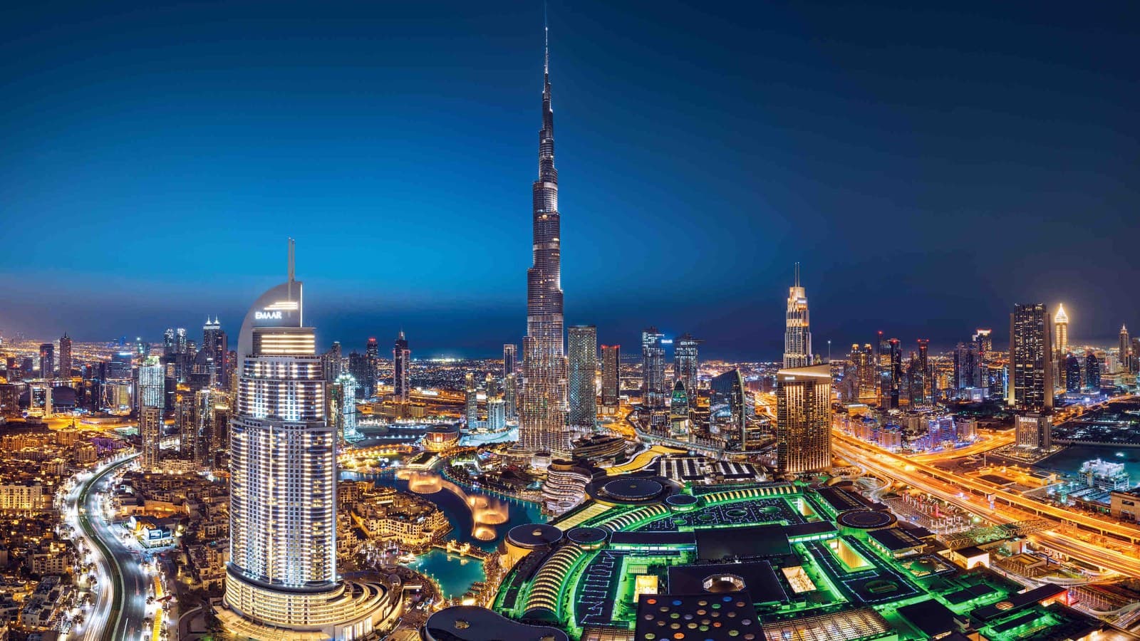 Downtown Dubai skyline with Burj Khalifa and Dubai Fountain at night